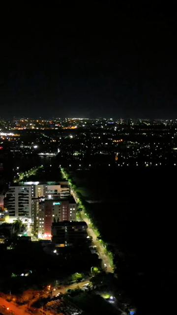 Vertical Aerial Night View of Kolkata City and Urban Infrastructure, India