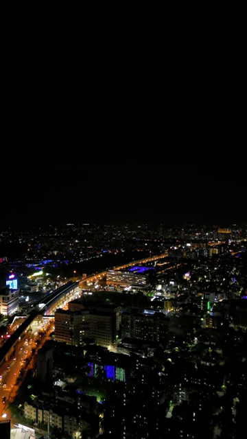 Vertical Aerial Night View of Kolkata City and Urban Infrastructure, India
