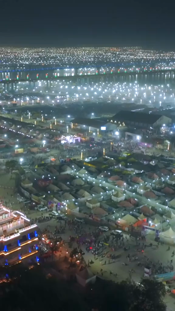 Vertical Aerial Night View of Maha Kumbh Mela 2025 in Prayagraj, India