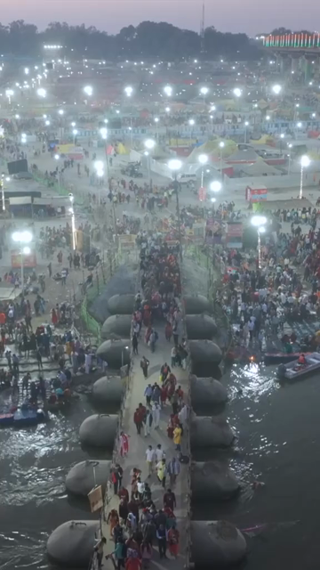 Vertical Aerial Night View of Maha Kumbh Mela 2025 in Prayagraj, India