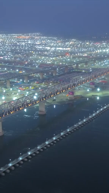 Vertical Aerial Night View of Maha Kumbh Mela 2025 in Prayagraj, India