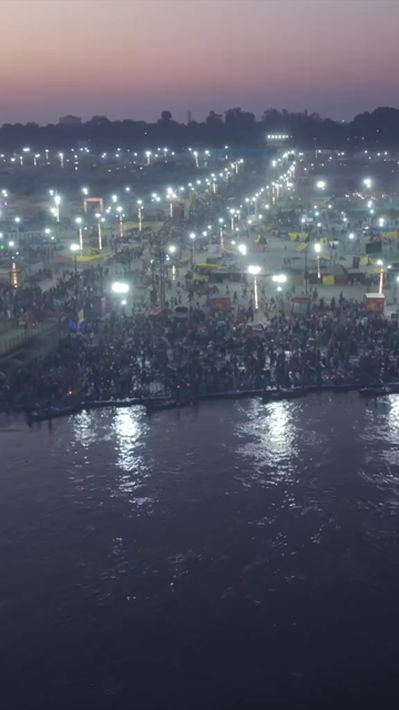 Vertical Aerial Night View of Maha Kumbh Mela 2025 in Prayagraj, India