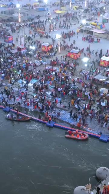 Vertical Aerial Night View of Maha Kumbh Mela 2025 in Prayagraj, India