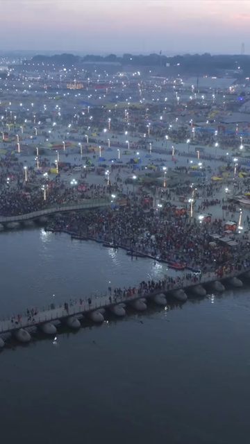 Vertical Aerial Night View of Maha Kumbh Mela 2025 in Prayagraj, India