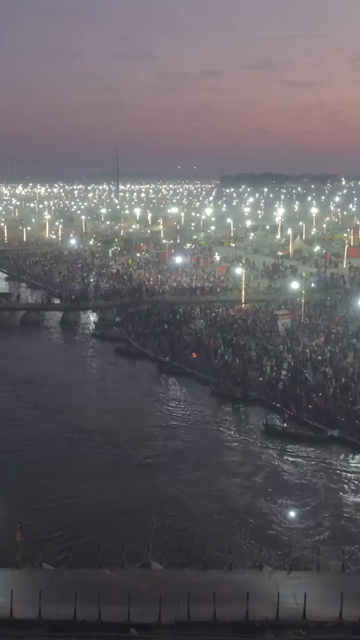 Vertical Aerial Night View of Maha Kumbh Mela 2025 in Prayagraj, India