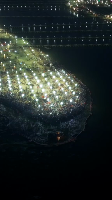 Vertical Aerial Night View of Maha Kumbh Mela 2025 in Prayagraj, India