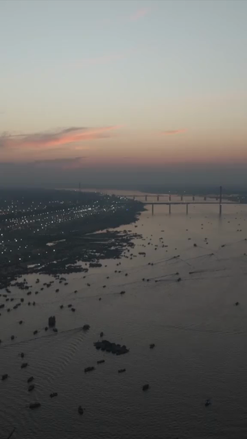 Vertical Aerial Night View of Maha Kumbh Mela 2025 in Prayagraj, India