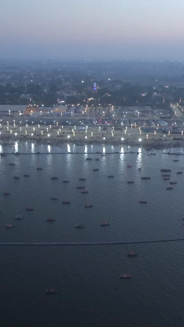 Vertical Aerial Night View of Maha Kumbh Mela 2025 in Prayagraj, India