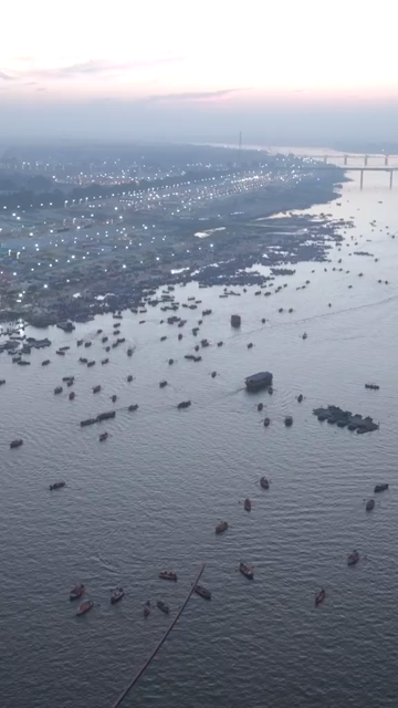 Vertical Aerial Night View of Maha Kumbh Mela 2025 in Prayagraj, India