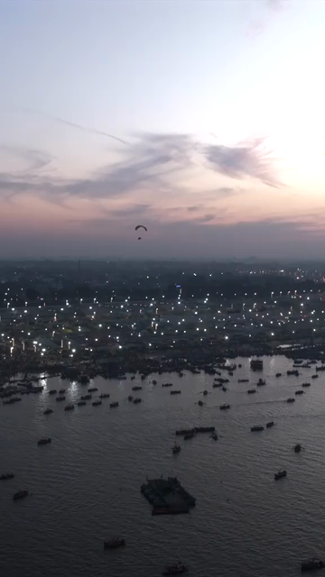 Vertical Aerial Night View of Maha Kumbh Mela 2025 in Prayagraj, India
