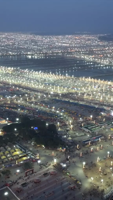 Vertical Aerial Night View of Maha Kumbh Mela 2025 in Prayagraj, India