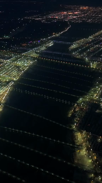 Vertical Aerial Night View of Maha Kumbh Mela 2025 in Prayagraj, India