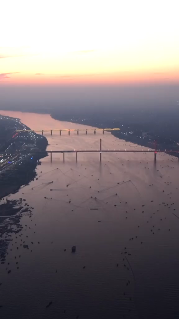 Vertical Aerial Night View of Maha Kumbh Mela 2025 in Prayagraj, India