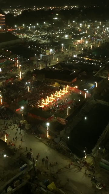 Vertical Aerial Night View of Maha Kumbh Mela 2025 in Prayagraj, India