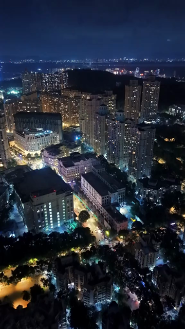 Vertical Aerial Night View of Mumbai Skyline and Illuminated Cityscape