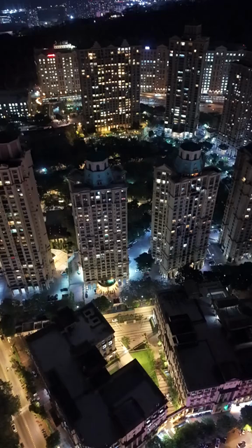 Vertical Aerial Night View of Mumbai Skyline and Illuminated Cityscape