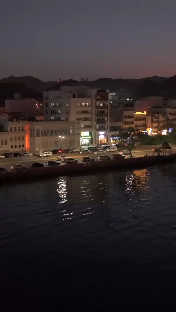 Vertical Aerial Night View of Mutrah Corniche Muscat Oman Waterfront and City Lights
