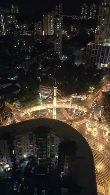 Vertical Aerial Night View of Nana Chowk Skywalk and Mumbai Cityscape