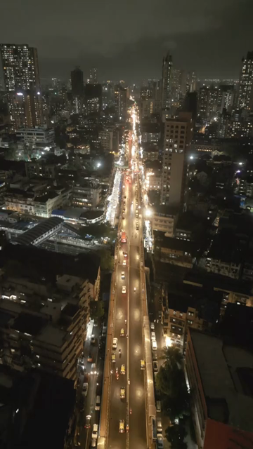 Vertical Aerial Night View of Nana Chowk Skywalk and Mumbai Cityscape