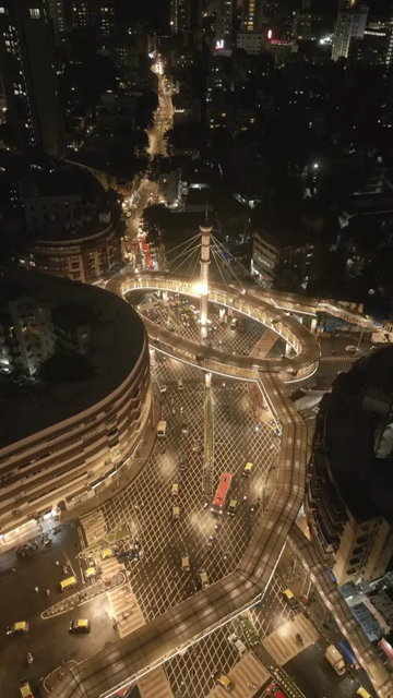 Vertical Aerial Night View of Nana Chowk Skywalk and Mumbai Cityscape