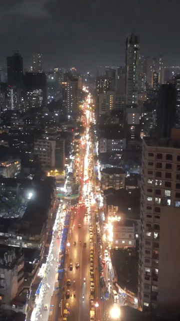 Vertical Aerial Night View of Nana Chowk Skywalk and Mumbai Cityscape