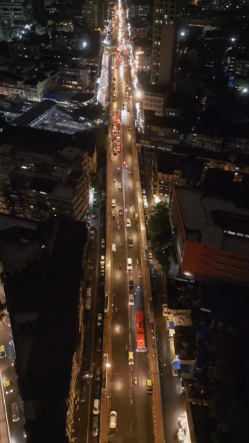 Vertical Aerial Night View of Nana Chowk Skywalk and Mumbai Cityscape