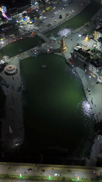 Vertical Aerial Night View of Nashik Cityscape and Godavari River in Maharashtra India