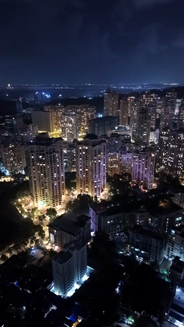 Vertical Aerial Night View of Powai Lake and Mumbai Skyline India