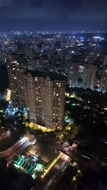 Vertical Aerial Night View of Powai Lake and Mumbai Skyline India