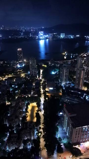 Vertical Aerial Night View of Powai Lake and Mumbai Skyline India