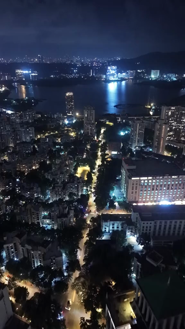 Vertical Aerial Night View of Powai Lake and Mumbai Skyline India