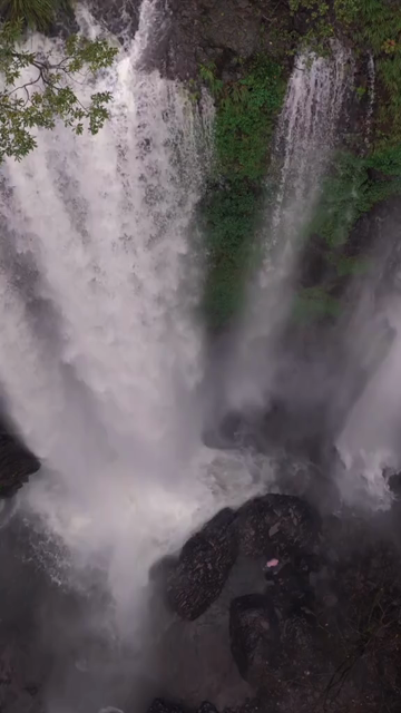 Vertical Aerial View of Barki Waterfall Amid Lush Green Forest Kolhapur Maharashtra