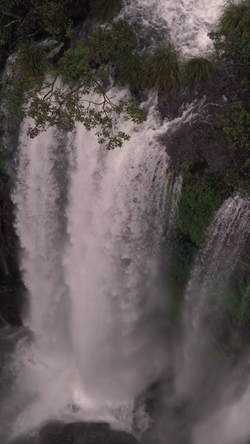 Vertical Aerial View of Barki Waterfall Amid Lush Green Forest Kolhapur Maharashtra