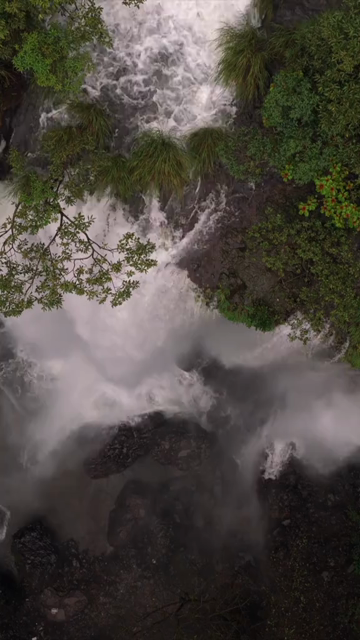 Vertical Aerial View of Barki Waterfall Amid Lush Green Forest Kolhapur Maharashtra