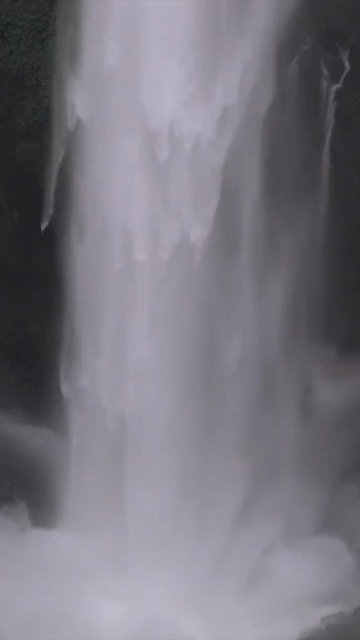 Vertical Aerial View of Barki Waterfall Amid Lush Green Forest Kolhapur Maharashtra