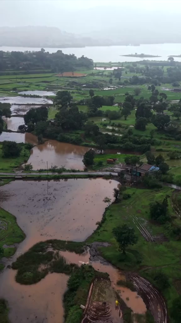 Vertical Aerial View of Bhandardara Lake and Lush Green Landscape Maharashtra India
