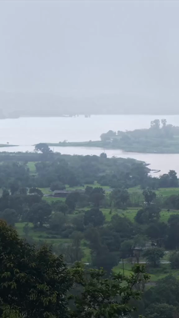 Vertical Aerial View of Bhandardara Lake and Lush Green Landscape Maharashtra India