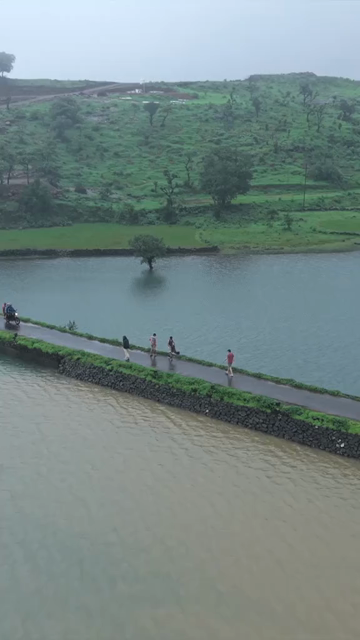 Vertical Aerial View of Bhandardara Lake and Lush Green Landscape Maharashtra India