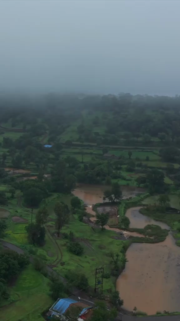 Vertical Aerial View of Bhandardara Lake and Lush Green Landscape Maharashtra India