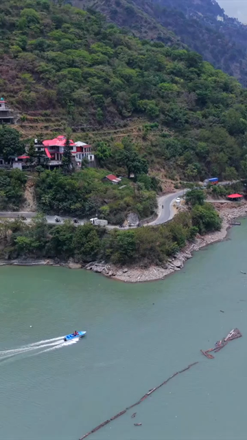 Vertical Aerial View of Bikers Riding Along Chamera Lake Road, Himachal Pradesh
