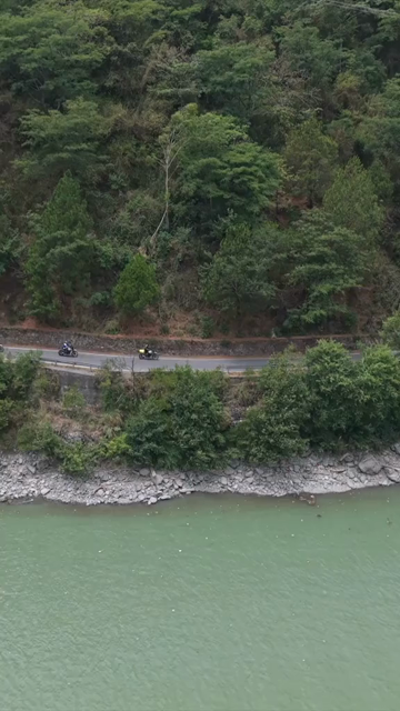 Vertical Aerial View of Bikers Riding Along Chamera Lake Road, Himachal Pradesh