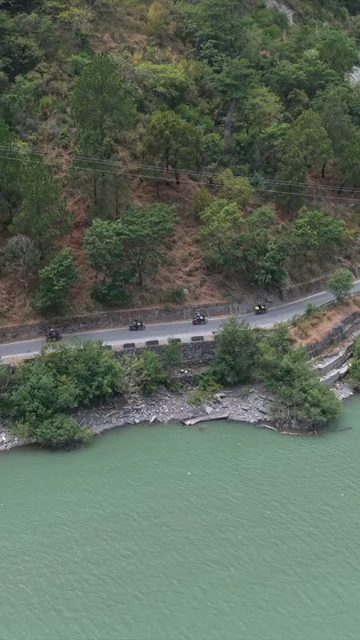 Vertical Aerial View of Bikers Riding Along Chamera Lake Road, Himachal Pradesh