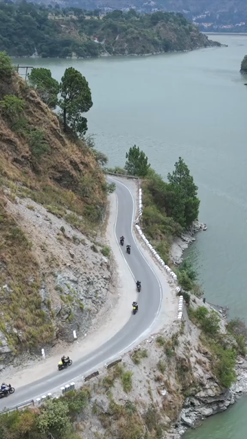 Vertical Aerial View of Bikers Riding Along Chamera Lake Road, Himachal Pradesh