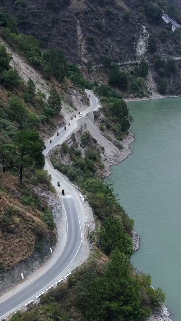Vertical Aerial View of Bikers Riding Along Chamera Lake Road, Himachal Pradesh