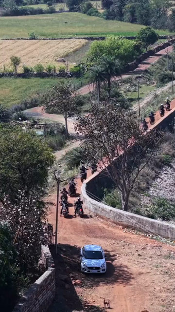 Vertical Aerial View of Bikers Riding Along Kolar Dam Reservoir Madhya Pradesh