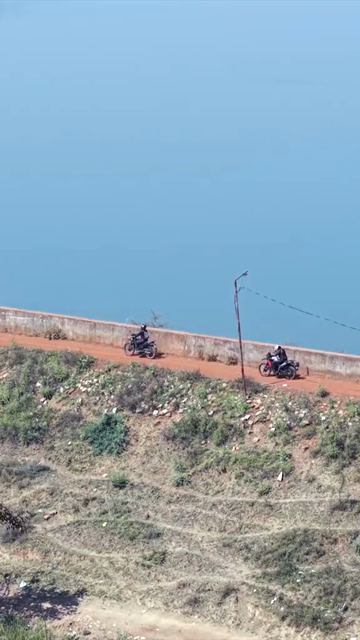 Vertical Aerial View of Bikers Riding Along Kolar Dam Reservoir Madhya Pradesh