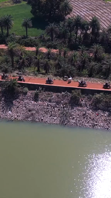Vertical Aerial View of Bikers Riding Along Kolar Dam Reservoir Madhya Pradesh