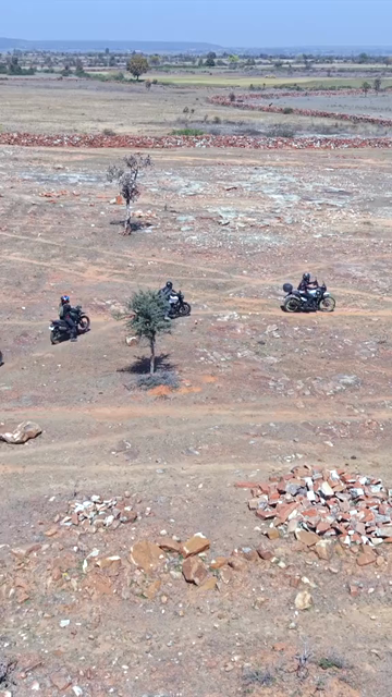 Vertical Aerial View of Bikers Riding Along Kolar Dam Reservoir Madhya Pradesh