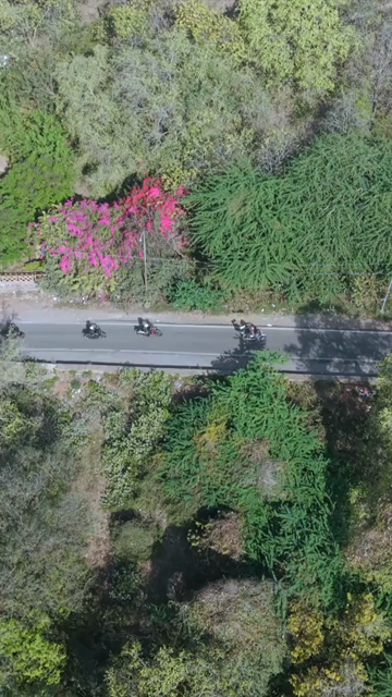 Vertical Aerial View of Bikers Riding Along Gwalior Fort Road Madhya Pradesh India