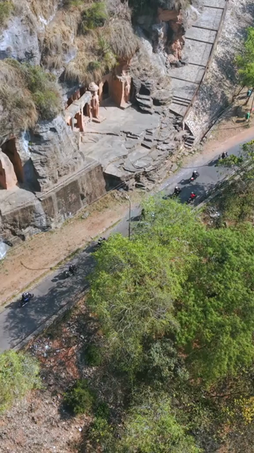 Vertical Aerial View of Bikers Riding Along Gwalior Fort Road Madhya Pradesh India